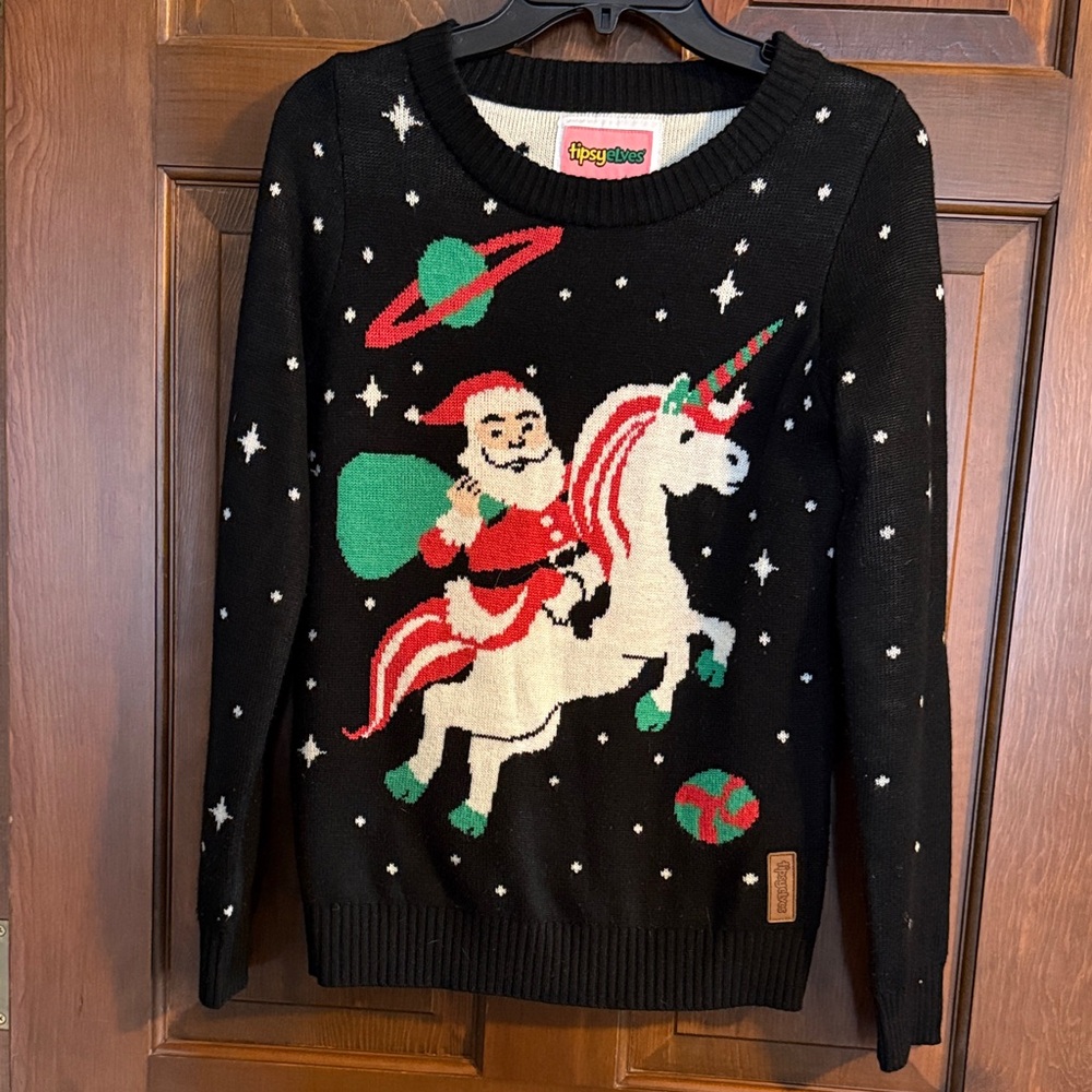 Tipsyelves Santa Claus on Christmas Unicorn black Sweater size Small, stars, EUC